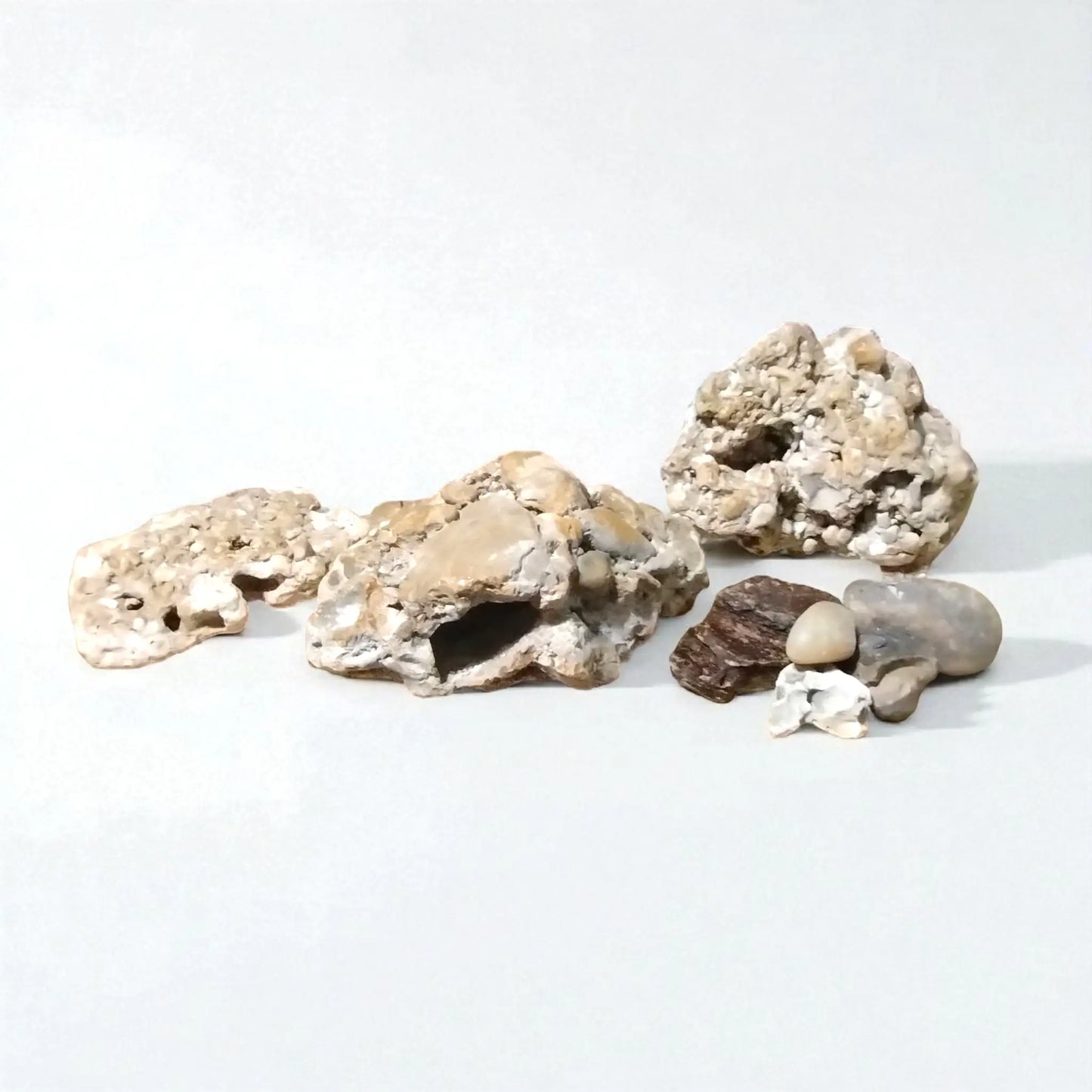 Decorative fish tank rocks on a white background