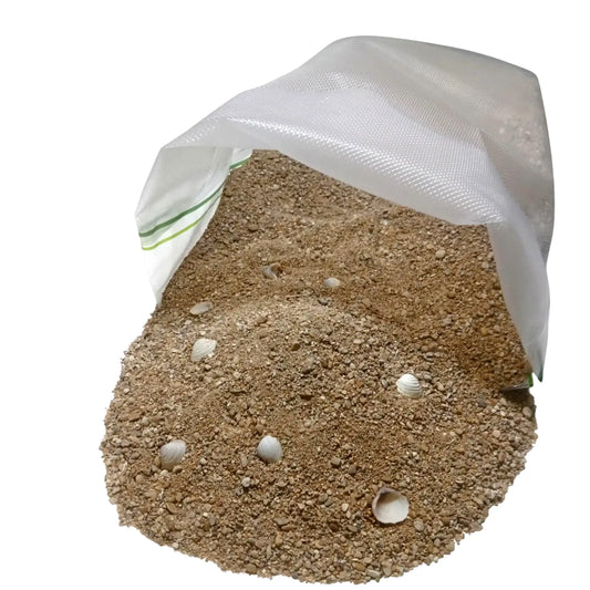 Bag of sand with shells on a white background