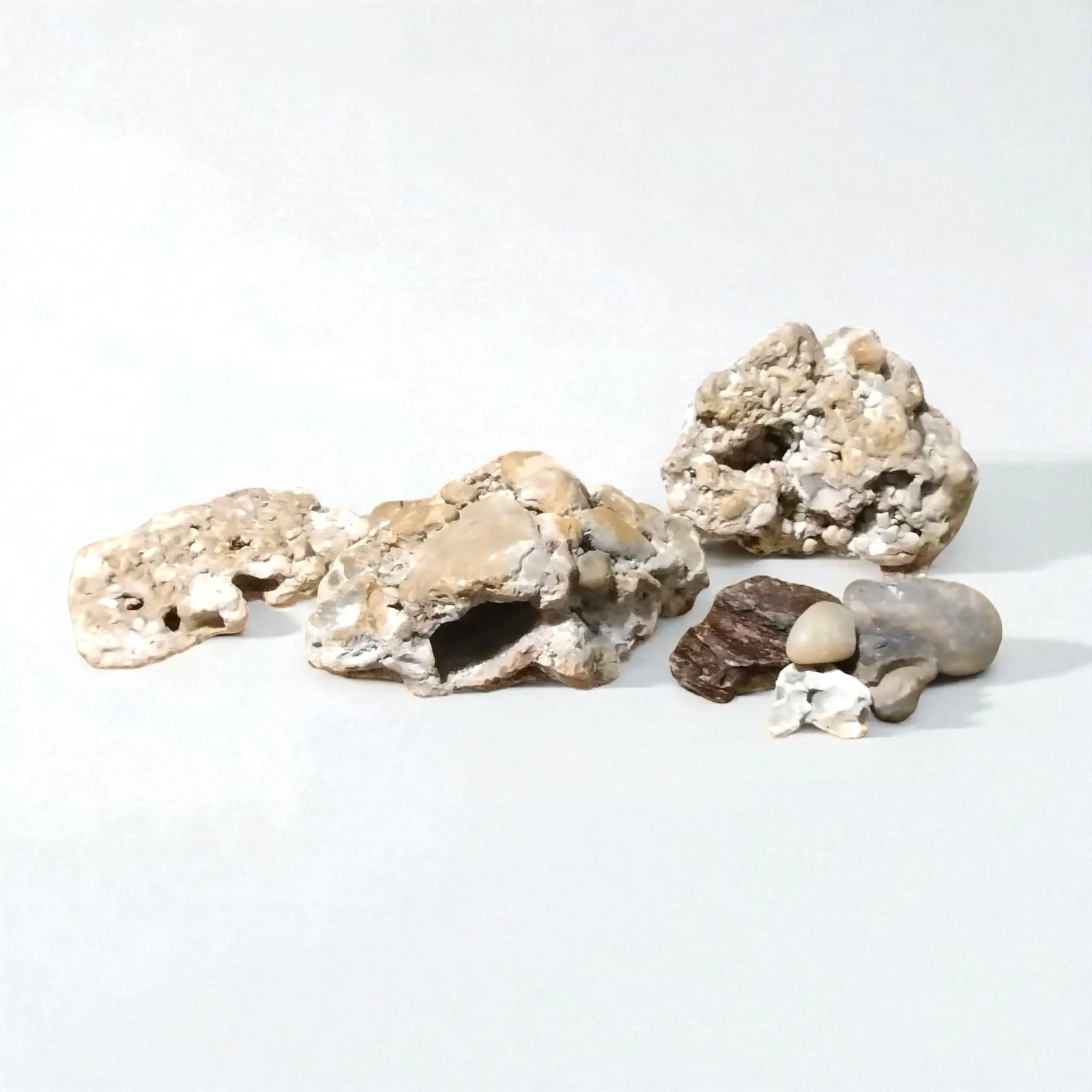 Decorative fish tank rocks on a white background