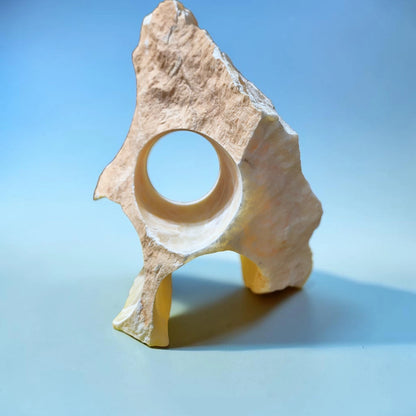 A piece of natural honey-white onyx for aquarium decorating.