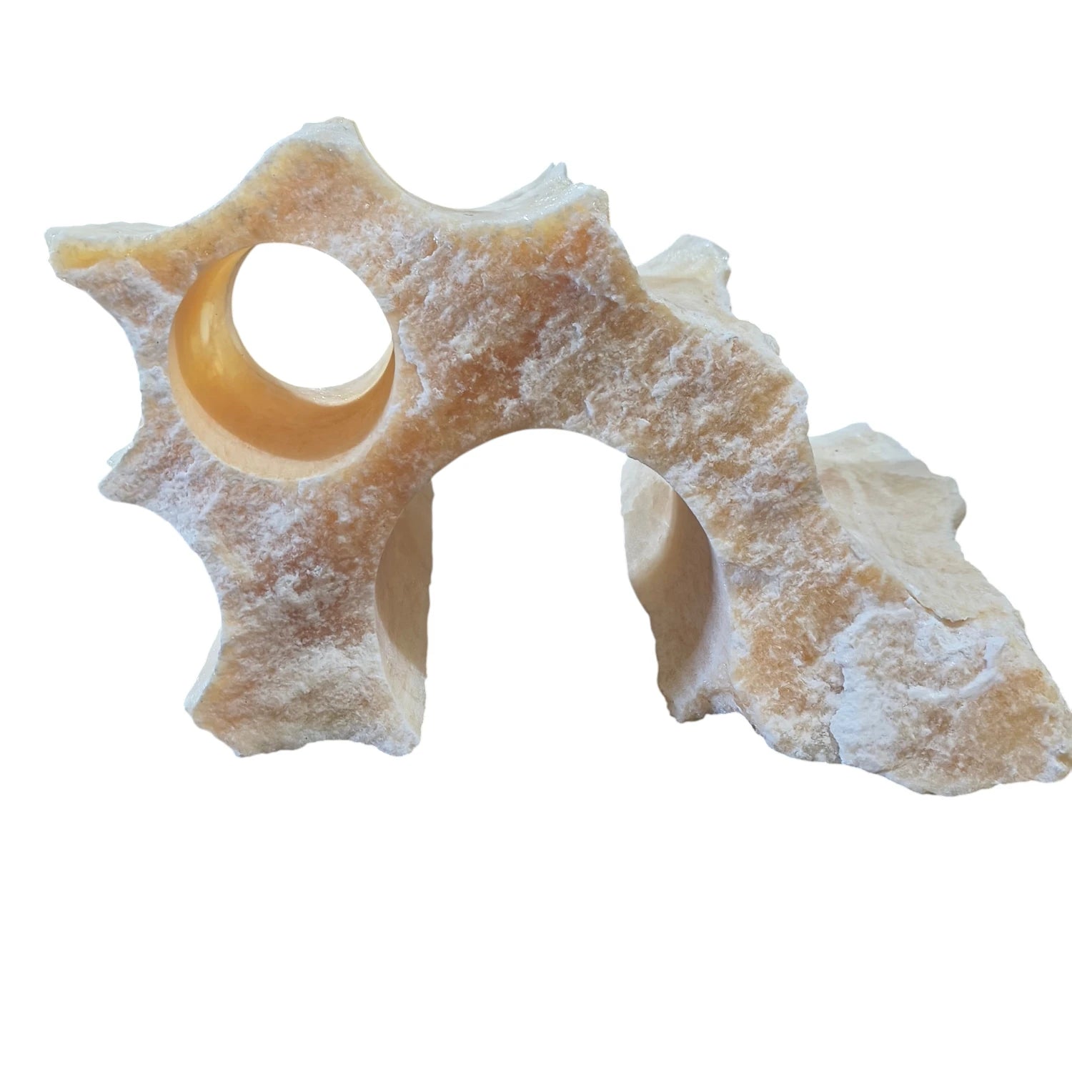 A natural onyx stone with an archway and swim-through hole displayed on a white background.